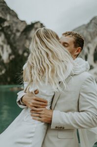 A photo of a couple hugging after their elopement at Lago Di Braies in the Italian Dolomites