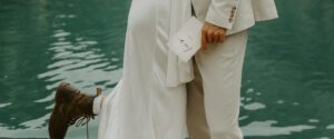 A close up shot of an elopement couple holding their vow books at their Dolomites elopement