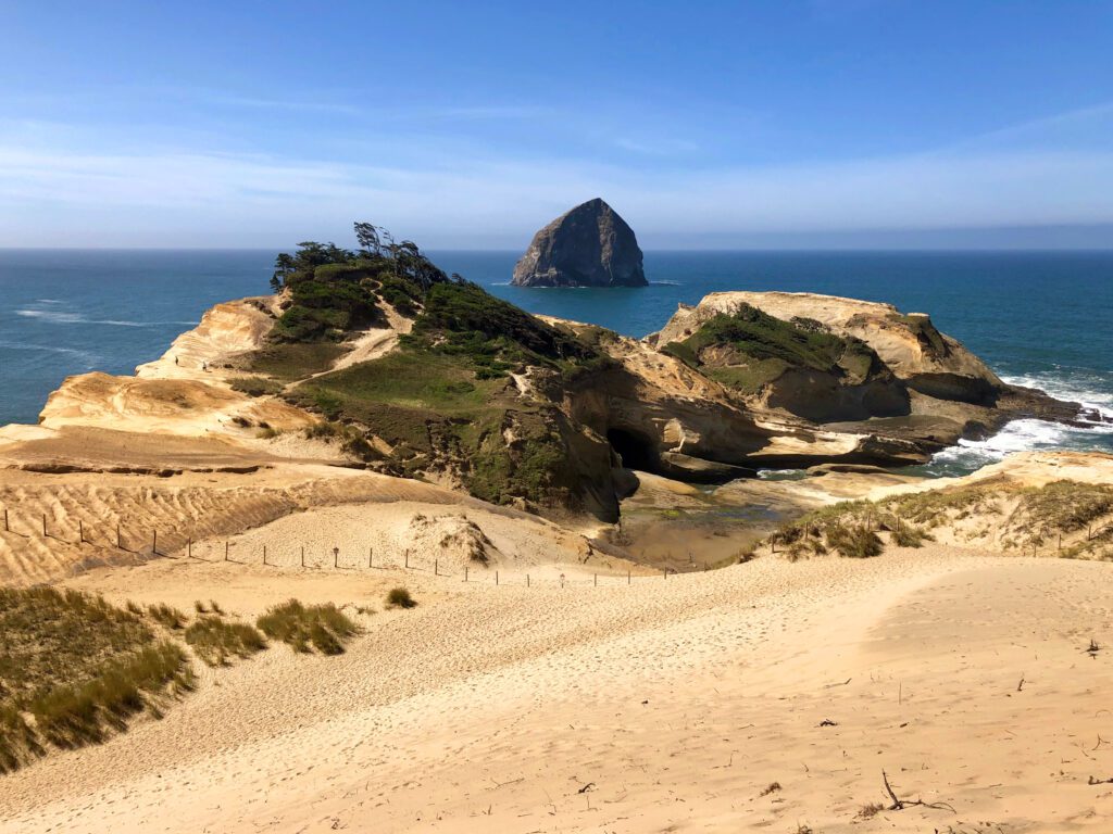 Cape Kiwanda cliffs overlooking Haystack Rock in Pacific City on the Oregon Coast