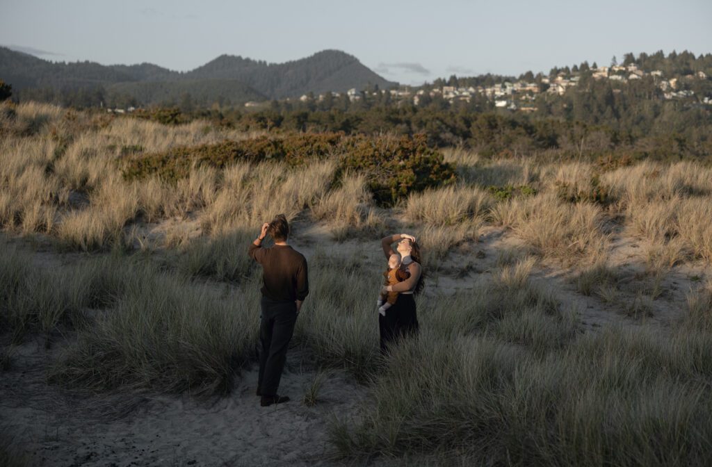 Couple walking through sandy dunes at Bob Straub State Park in Pacific City on the Oregon Coast