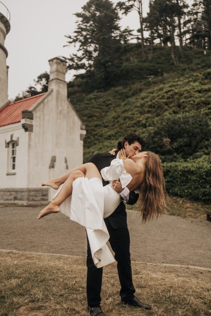 Bride and groom at Heceta Head Lighthouse on the Oregon Coast during an intimate wedding elopement