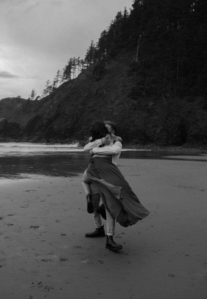 Couple embracing on Indian Beach in Ecola State Park along the Oregon Coast