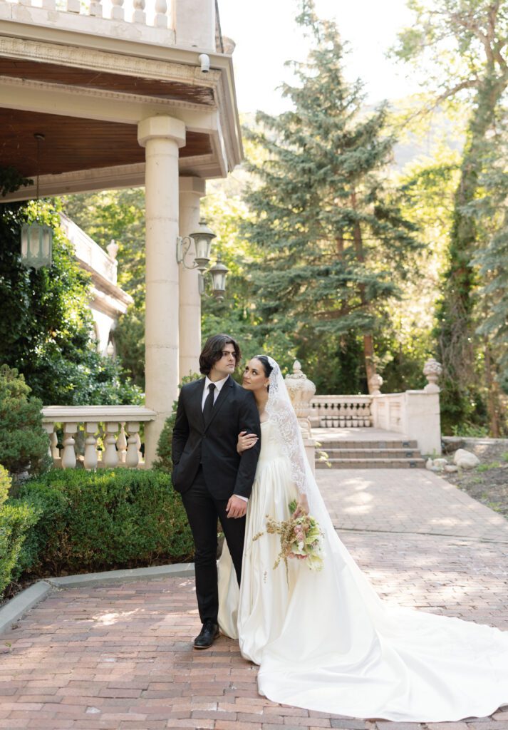 A bride and groom portrait out of the chateau at La Caille Wedding Venue in Utah