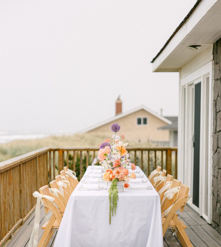 Outdoor dinner table setup on the beach at Our Plaace Airbnb in Neskowin, Oregon for a small intimate wedding reception