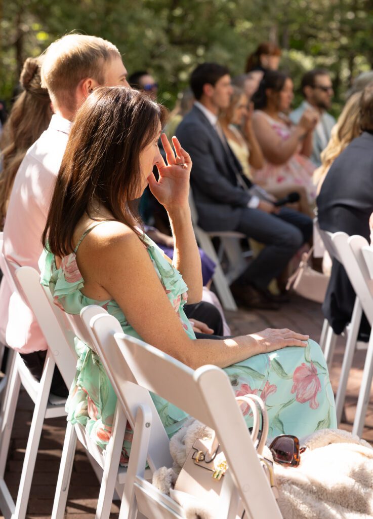 A guest cries at a wedding ceremony at la caille utah