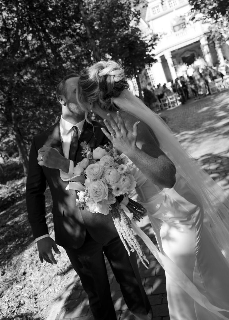 A bride and groom celebrate by showing their rings after their ceremony at la caille utah 