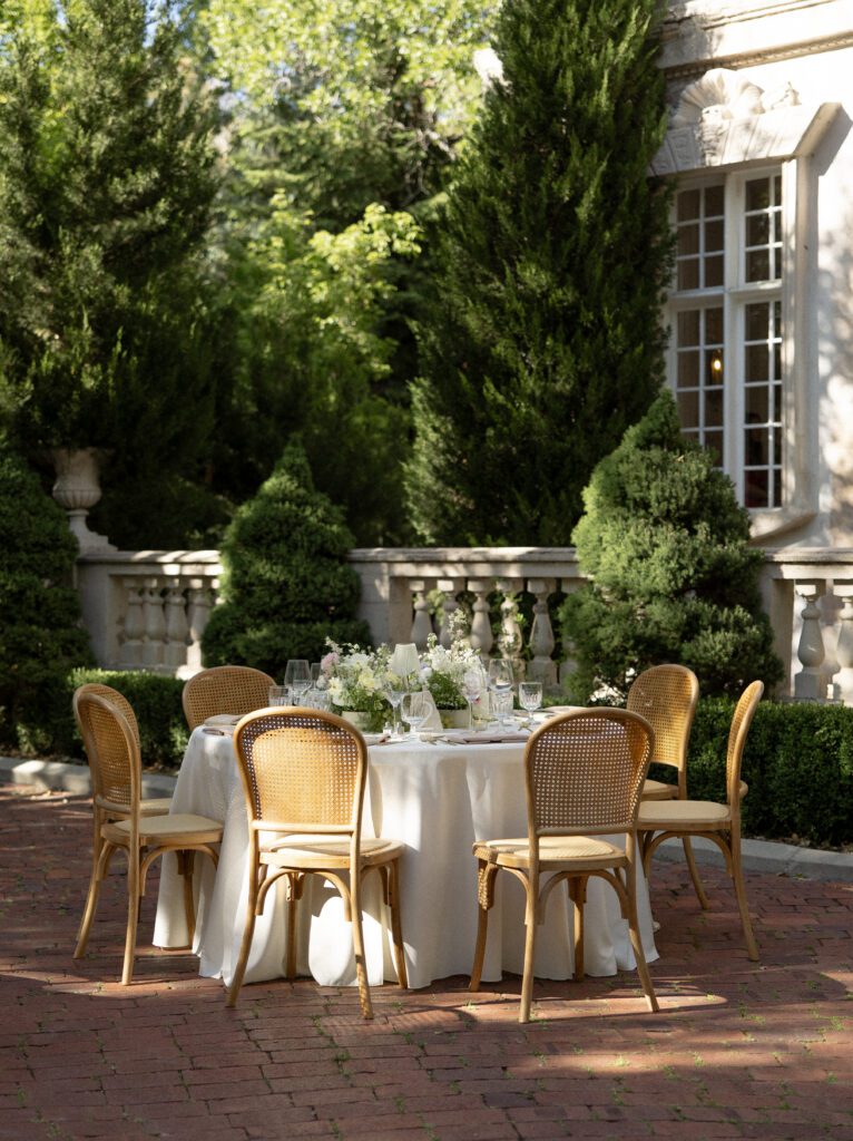 Outdoor wedding dinner tables in the gardens at La Caille Utah