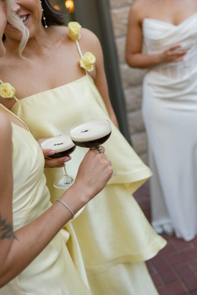 wedding guests hold drinks at la Calle utah 